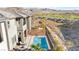 Aerial view of a landscaped backyard with a pool and a two-story home with mountain views at 41 Strada Moscato, Henderson, NV 89011