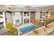 Aerial view of a two-story home with backyard pool, patio, desert landscaping, and mountain views at 41 Strada Moscato, Henderson, NV 89011