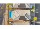 Aerial view showcasing a backyard pool, patio, roof with solar panels, and neighboring homes at 41 Strada Moscato, Henderson, NV 89011