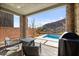 Relaxing backyard area with covered patio, grill, fire pit, and refreshing small pool at 41 Strada Moscato, Henderson, NV 89011