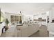 Spacious living room with modern decor, open layout, and access to the outdoor patio and pool at 41 Strada Moscato, Henderson, NV 89011