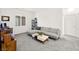 A living room featuring neutral walls and carpet, and modern furniture at 41 Strada Moscato, Henderson, NV 89011