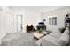 Spacious living room with gray sofa, workstation, and sleek modern decor for comfortable living at 41 Strada Moscato, Henderson, NV 89011