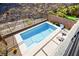 Inviting private backyard pool with sleek modern design, lounge chairs, and mountain views at 41 Strada Moscato, Henderson, NV 89011