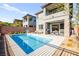 A view of the backyard pool, patio, and exterior of a two-story home with mountain views at 41 Strada Moscato, Henderson, NV 89011