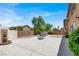 Beautiful backyard with a decorative fountain, desert landscaping, and a spacious concrete patio with seating at 4216 Thunder Twice St, Las Vegas, NV 89129