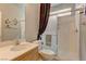Bathroom featuring vanity, toilet, framed mirror and walk-in shower with sliding glass door at 4216 Thunder Twice St, Las Vegas, NV 89129