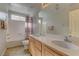 Well-lit bathroom features a double vanity and combination tub and shower at 4216 Thunder Twice St, Las Vegas, NV 89129
