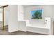 Bright and airy soaking tub with jets, a large window view, and a sliding glass door nearby at 4216 Thunder Twice St, Las Vegas, NV 89129