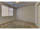 Neutral bedroom with carpet floors, baseboards and a large window for natural light at 4216 Thunder Twice St, Las Vegas, NV 89129