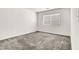 Bedroom with plush neutral carpets, a single window, and white walls providing a blank canvas at 4216 Thunder Twice St, Las Vegas, NV 89129