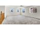 Spacious bonus room with plush neutral carpets, three windows, and lots of natural light at 4216 Thunder Twice St, Las Vegas, NV 89129