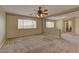 Second upstairs living area with neutral paint, plush carpet and lots of natural light at 4216 Thunder Twice St, Las Vegas, NV 89129