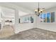 Open-concept dining area with views of the kitchen and living room through bright white columns at 4216 Thunder Twice St, Las Vegas, NV 89129