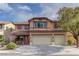 Two-story home with terracotta roof, muted pink shutters, and a three-car garage on a sunny day at 4216 Thunder Twice St, Las Vegas, NV 89129
