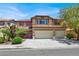 Inviting two-story home featuring a well-manicured front yard and a spacious two-car garage at 4216 Thunder Twice St, Las Vegas, NV 89129