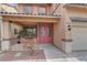 Charming front porch with seating area, double doors, desert landscaping, and decorative light fixture at 4216 Thunder Twice St, Las Vegas, NV 89129
