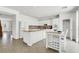 Bright, updated kitchen with white cabinets, granite countertops, and stainless steel appliances at 4216 Thunder Twice St, Las Vegas, NV 89129