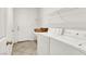 Functional laundry room featuring modern appliances, storage shelves, and tile flooring at 4216 Thunder Twice St, Las Vegas, NV 89129