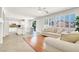 Bright open-concept living room flows to the kitchen, featuring tile and wood floors and plantation shutters at 4216 Thunder Twice St, Las Vegas, NV 89129