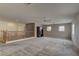 Spacious carpeted upstairs loft featuring neutral paint, ceiling fan and large windows at 4216 Thunder Twice St, Las Vegas, NV 89129