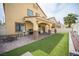 The backyard features a covered patio with ceiling fans and astroturf at 4440 Pacific Crest Ave, Las Vegas, NV 89115