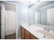 Bathroom featuring double sink vanity and a shower with white shower curtain at 4440 Pacific Crest Ave, Las Vegas, NV 89115