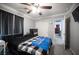 This bedroom has a ceiling fan, carpet, and crown molding at 4440 Pacific Crest Ave, Las Vegas, NV 89115