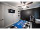 This bedroom has a ceiling fan, carpet, and crown molding at 4440 Pacific Crest Ave, Las Vegas, NV 89115