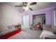 Bedroom featuring carpet, fan, queen sized bed, and a closet with assorted decor at 4440 Pacific Crest Ave, Las Vegas, NV 89115