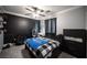 This bedroom has a ceiling fan, carpet, and crown molding at 4440 Pacific Crest Ave, Las Vegas, NV 89115