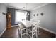 Dining room featuring a wooden table, chandelier, and decorative wall art for an inviting and comfortable space at 4440 Pacific Crest Ave, Las Vegas, NV 89115