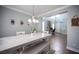 Open concept dining area with views to living room and front entry featuring ample lighting and modern decor at 4440 Pacific Crest Ave, Las Vegas, NV 89115