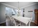 Bright dining room featuring a staircase and views into the kitchen, creating an inviting and flowing space at 4440 Pacific Crest Ave, Las Vegas, NV 89115