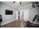 This exercise room has hardwood floors, a ceiling fan and access to a separate room at 4440 Pacific Crest Ave, Las Vegas, NV 89115