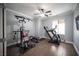 Home gym features exercise equipment, neutral walls, and wood-look tile flooring at 4440 Pacific Crest Ave, Las Vegas, NV 89115