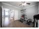 Bright home gym offering a variety of equipment and easy access to the adjacent bathroom at 4440 Pacific Crest Ave, Las Vegas, NV 89115