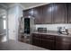 Modern kitchen featuring stainless steel appliances and dark wood cabinetry at 4440 Pacific Crest Ave, Las Vegas, NV 89115