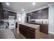 Spacious kitchen with stainless steel appliances, a central island, and ample counter space at 4440 Pacific Crest Ave, Las Vegas, NV 89115