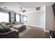 Inviting living room with a large sectional sofa, wood-look floors and views of connected rooms at 4440 Pacific Crest Ave, Las Vegas, NV 89115