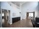 Bright living room features a high ceiling and a staircase with white railing at 4440 Pacific Crest Ave, Las Vegas, NV 89115