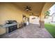 Covered patio featuring ceiling fans, brick columns, and backyard access at 4440 Pacific Crest Ave, Las Vegas, NV 89115