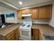 Well-lit kitchen featuring a white gas range and plenty of cabinet storage space at 4770 Topaz St # 73, Las Vegas, NV 89121