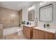 Modern bathroom with double vanity, sleek fixtures, and a tub shower combo at 5071 Pioneer Ave # 203, Las Vegas, NV 89146