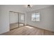 A sunlit bedroom featuring modern lighting, and a mirrored closet at 5071 Pioneer Ave # 203, Las Vegas, NV 89146