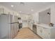 Modern kitchen with stainless steel appliances, white cabinets, and granite countertops at 5071 Pioneer Ave # 203, Las Vegas, NV 89146