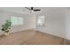 Inviting living area with wood-look floors, a bar, and a leafy plant at 5071 Pioneer Ave # 203, Las Vegas, NV 89146