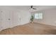 Bright, open living room with wood-look floors, ceiling fan, and a window view at 5071 Pioneer Ave # 203, Las Vegas, NV 89146