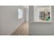 Living area with wood-look floors, a bar, leading to kitchen with stainless steel appliances at 5071 Pioneer Ave # 203, Las Vegas, NV 89146