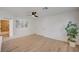 Spacious living area with wood-look floors, bathroom access, and neutral decor at 5071 Pioneer Ave # 203, Las Vegas, NV 89146